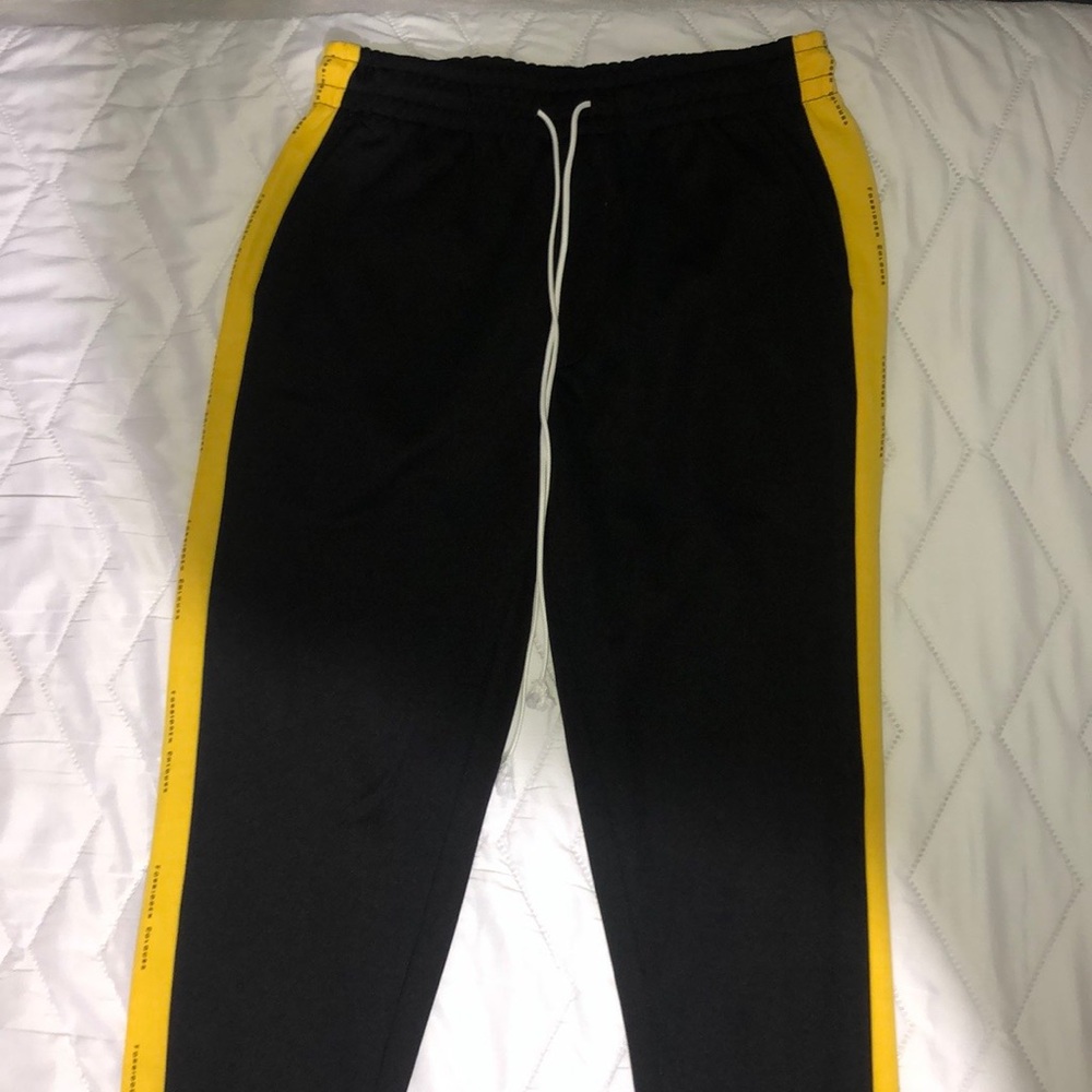 Black Pants With Yellow Stripes